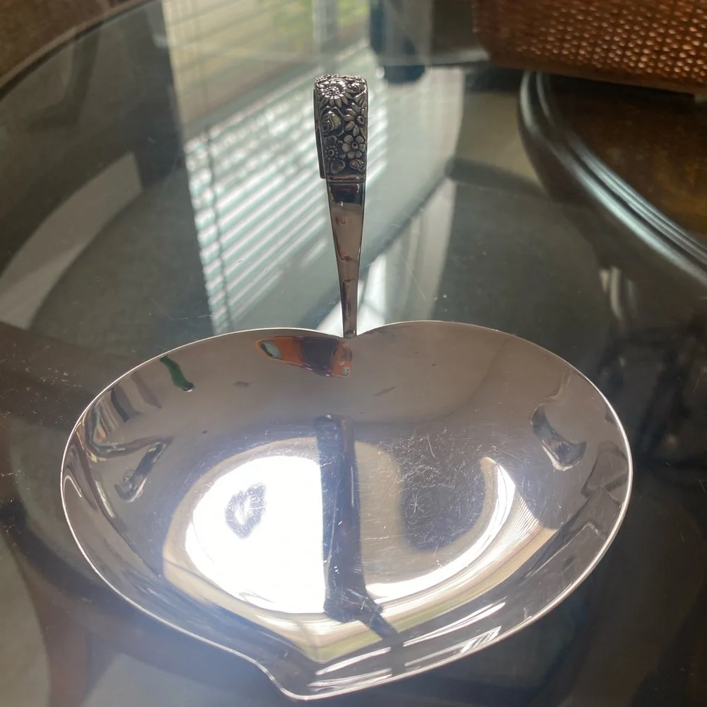 Ornate Silver Ladle with Intricate Handle